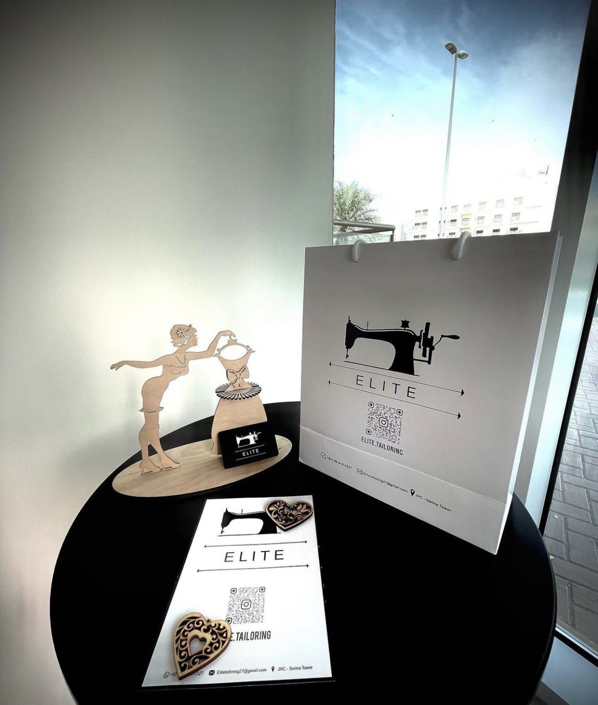 Elite Tailoring branded bag and cards